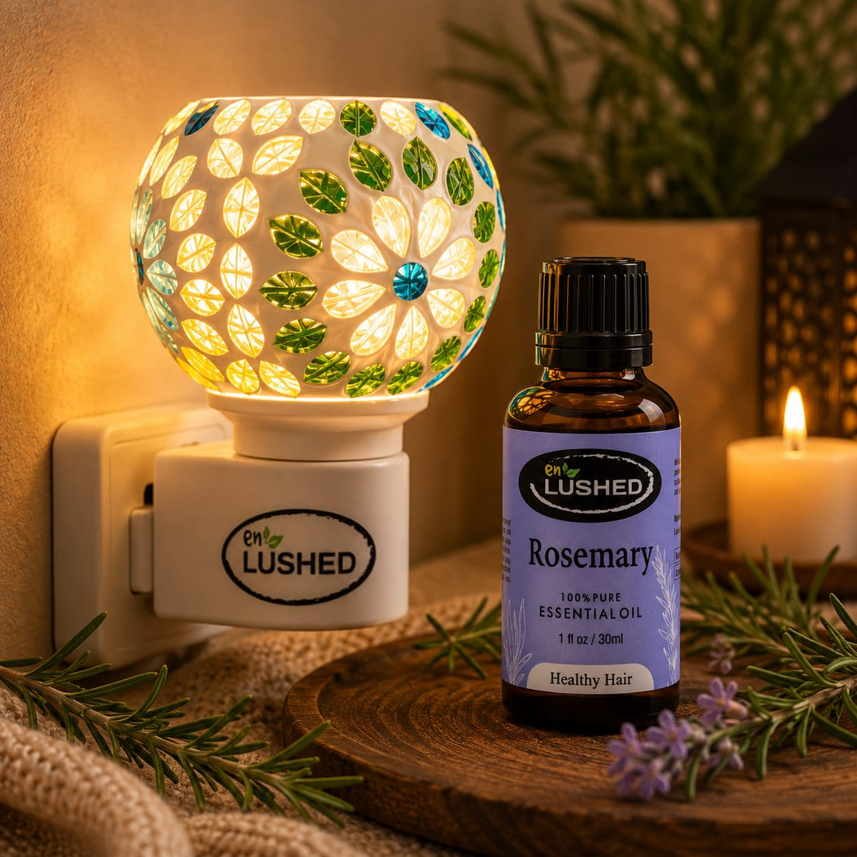 Plug-in ceramic aroma diffuser lamp beside Enlushed Rosemary essential oil bottle for healthy hair