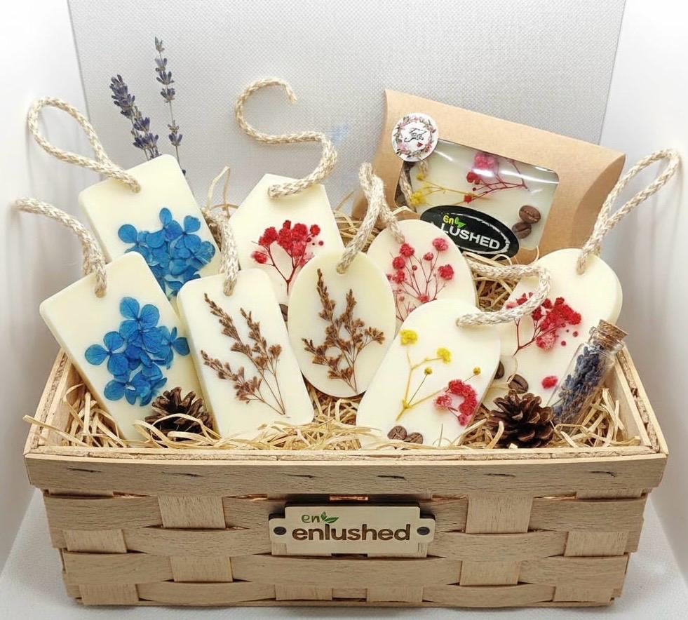 Wax air freshener tags arranged in wicker gift basket
