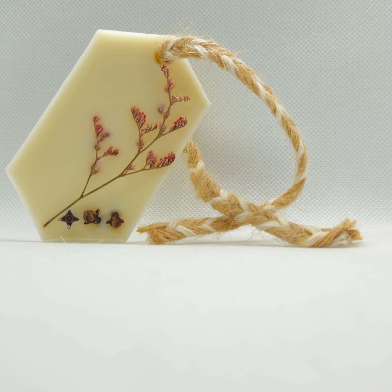 Hexagon-shaped wax air freshener duo tied with natural jute